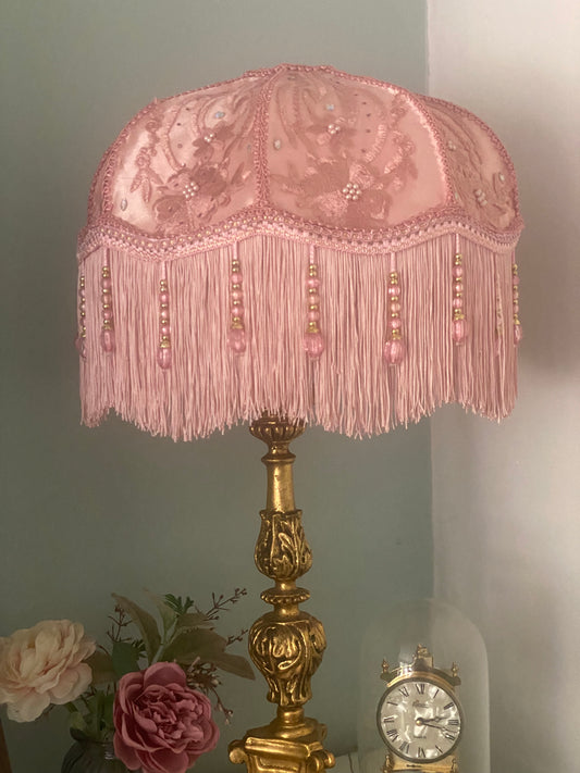 Full view – “Handmade pink Victorian silk lampshade overlaid with floral silk and adorned with sparkling diamantes, finished with pink fringe and pink beaded trim – romantic vintage lighting.”closer view