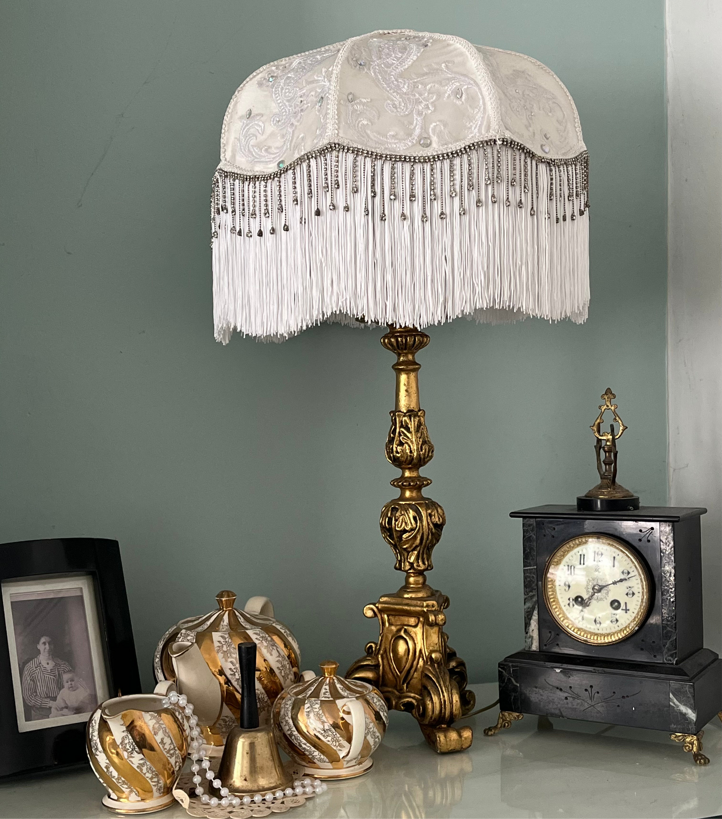 Full view – “Handmade white Victorian silk lampshade with lace overlay, diamante beading, long white fringe, and sparkling diamante trim.”