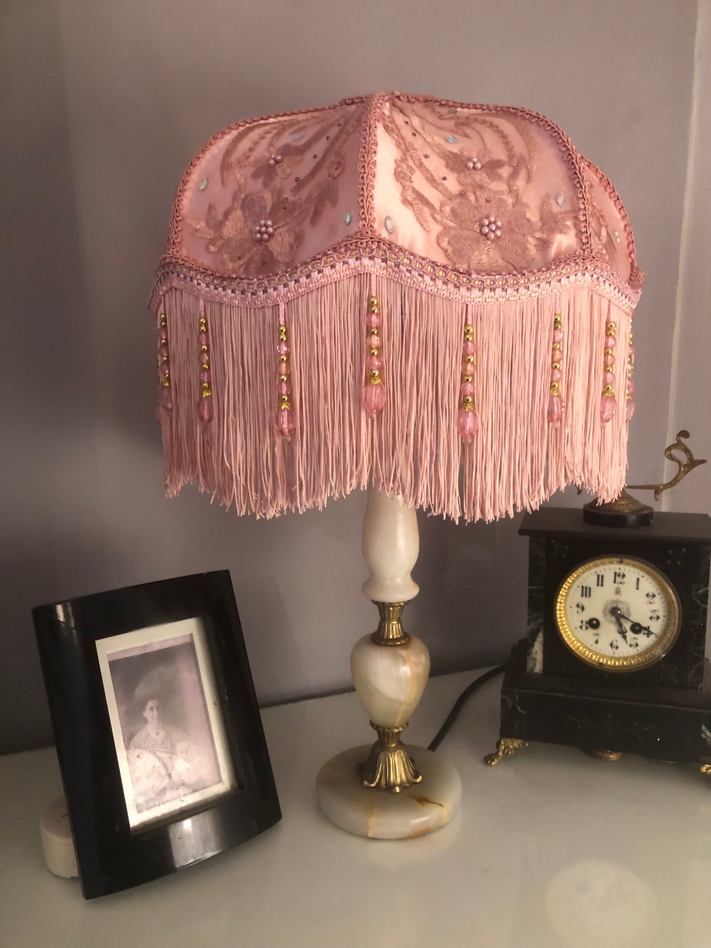 Close-up of silk texture – “Smooth pink silk base with floral silk overlay and diamante accents on a Victorian lampshade – luxury handmade period design.”