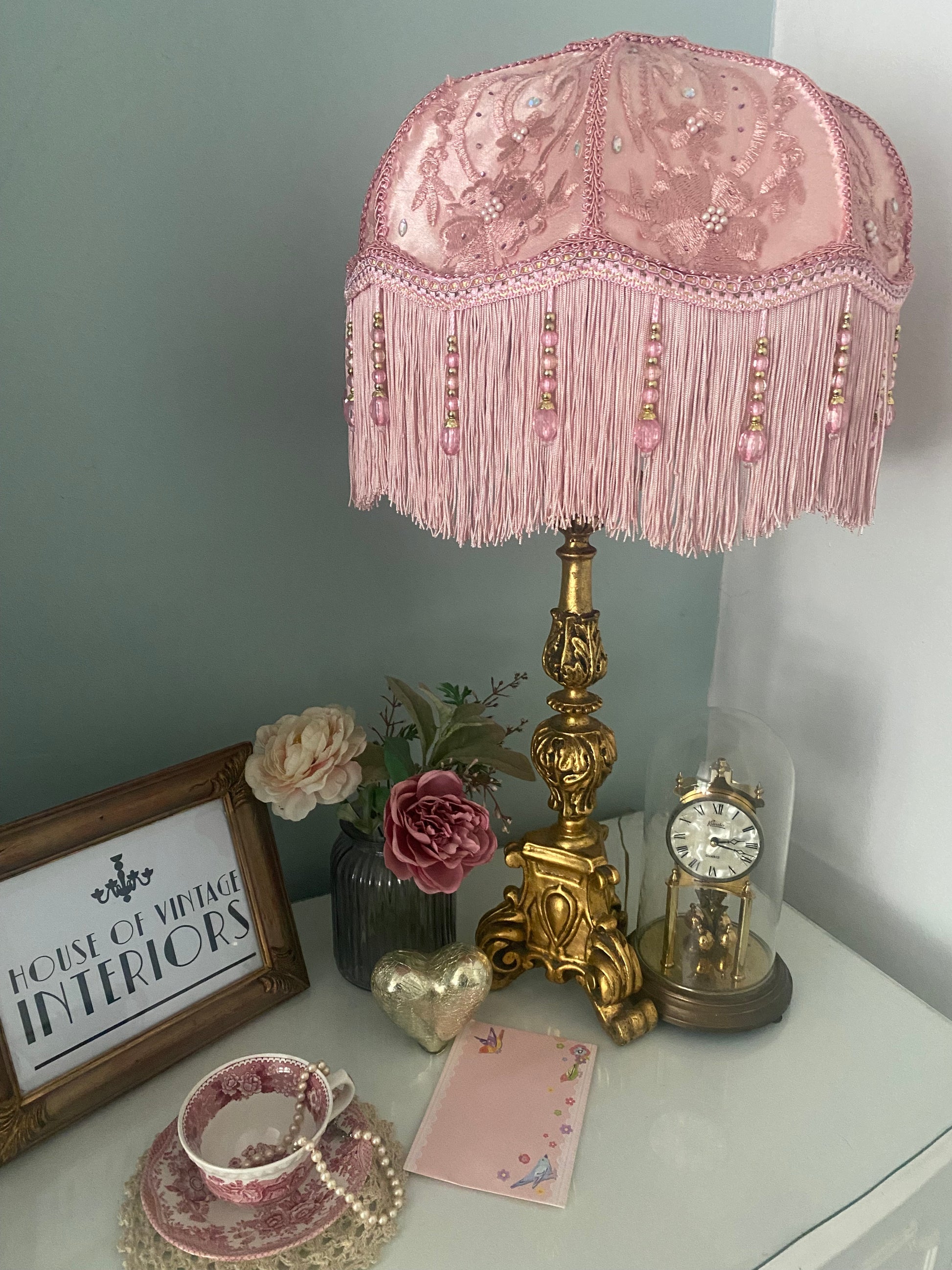 Full view – “Handmade pink Victorian silk lampshade overlaid with floral silk and adorned with sparkling diamantes, finished with pink fringe and pink beaded trim – romantic vintage lighting.”
