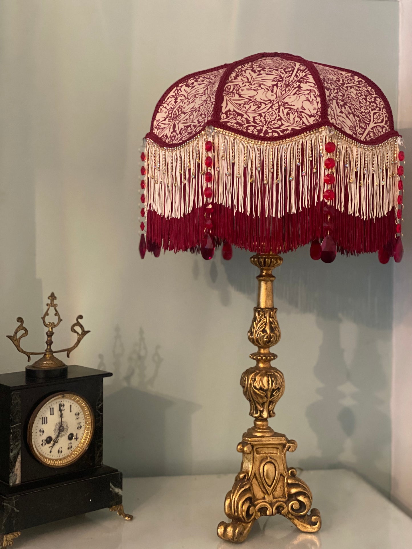 Full view – “Handmade Victorian lampshade in William Morris ‘Brer Rabbit’ fabric with burgundy trim, gold diamante fringe, and ruby glass crystal gems – elegant Arts and Crafts inspired lighting.”